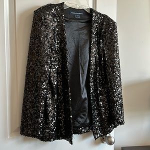 Black sequins blazer. Worn once! In perfect condition.